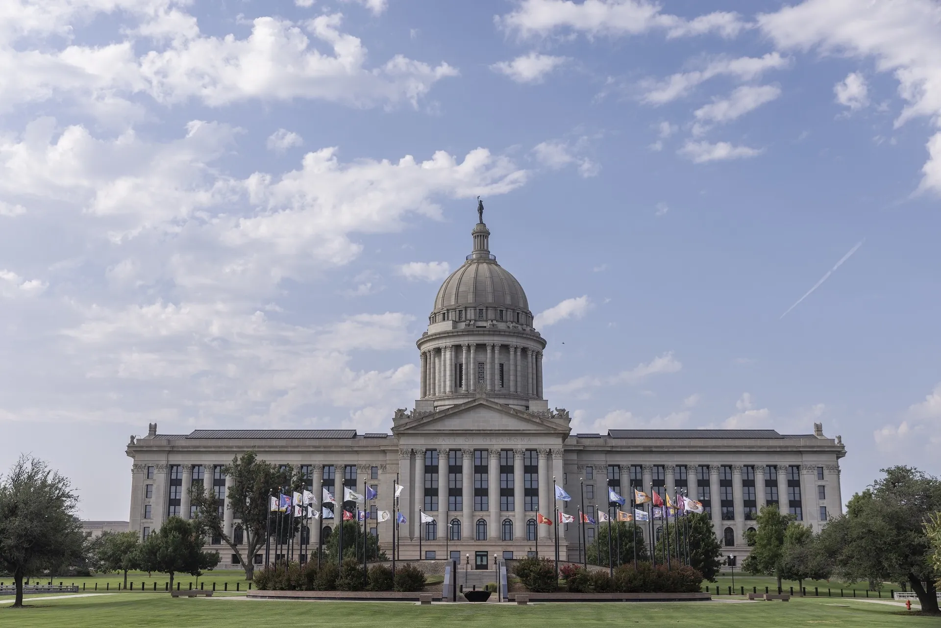 Oklahoma State Capitol north façade with dome and flag plaza
